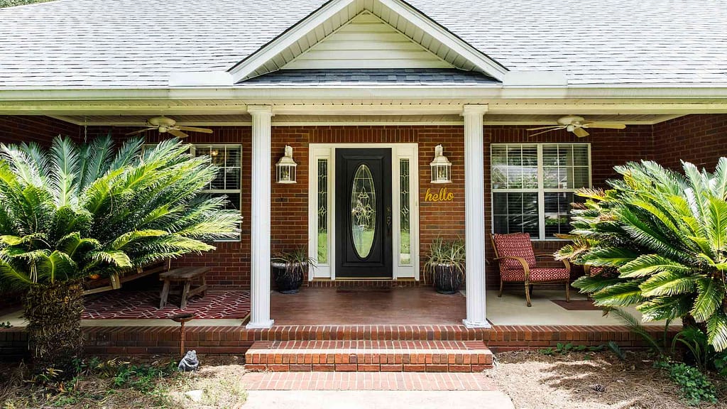 exterior north jersey doors with palm trees and pillars surrounding. One of many in our exterior door showroom