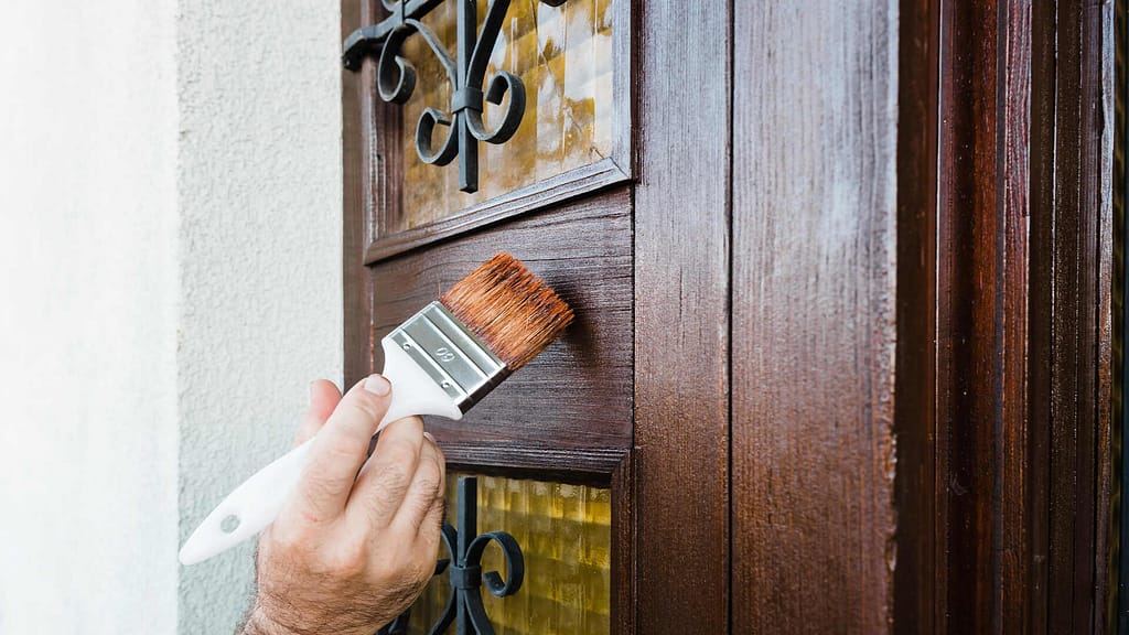 Painting a door using paintbrush