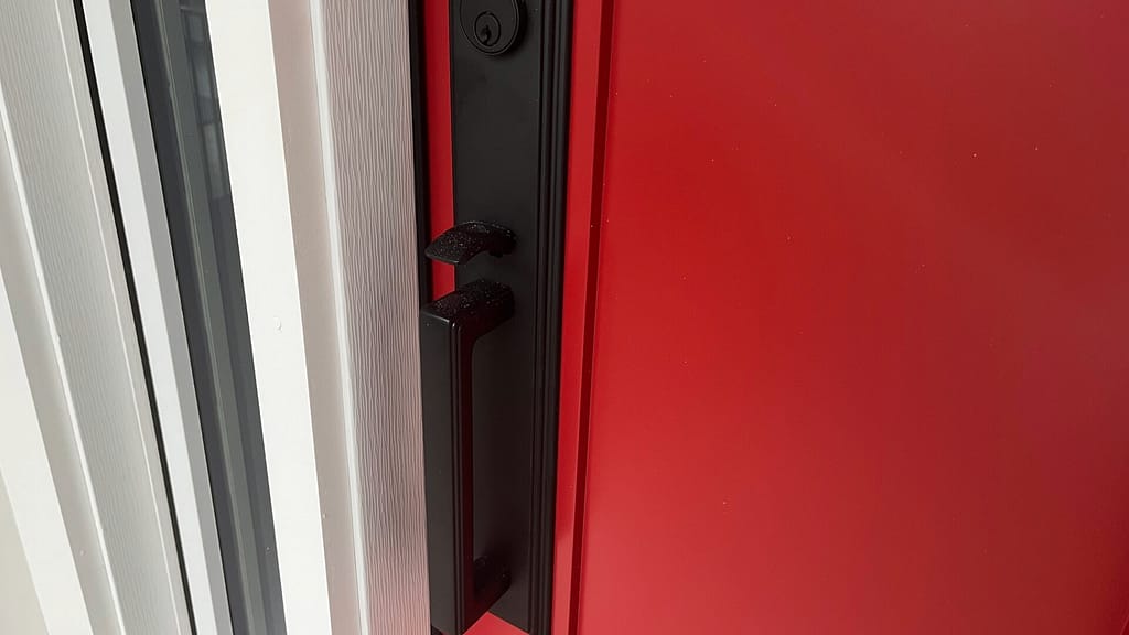 red door with black hardware by madison door