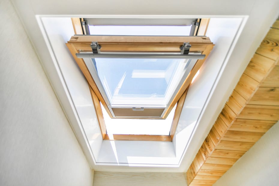 Open wood-framed skylight for home adding natural light to attic space.